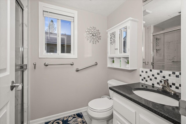1216 W Candlewood Ct, Spokane, WA 99218 - full bath featuring a stall shower, vanity, decorative backsplash, and tile patterned flooring