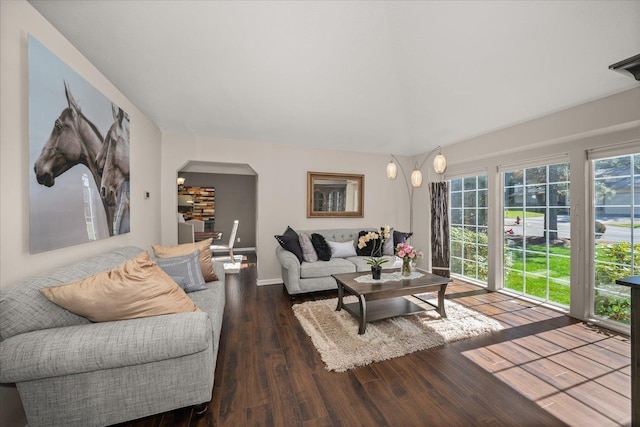 1216 W Candlewood Ct, Spokane, WA 99218 - living room with arched walkways, wood finished floors, and baseboards