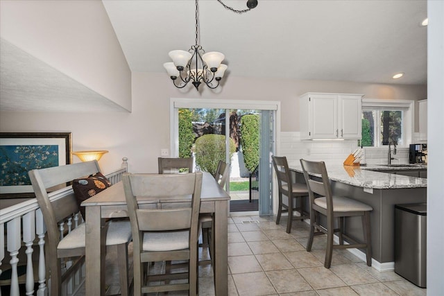 1216 W Candlewood Ct, Spokane, WA 99218 - dining space with plenty of natural light, a chandelier, light tile patterned floors, and recessed lighting