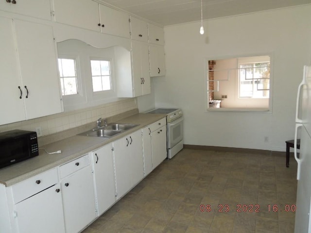 917 E Walton Ave, Spokane, WA 99207 - kitchen featuring white appliances, a sink, white cabinets, and decorative backsplash