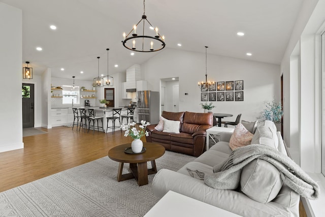 2419 C Indian Ridge Rd, Chewelah, WA 99109 - living area with a chandelier, light wood-style floors, recessed lighting, and high vaulted ceiling