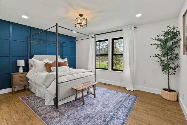2419 C Indian Ridge Rd, Chewelah, WA 99109 - bedroom with wood finished floors, baseboards, and recessed lighting