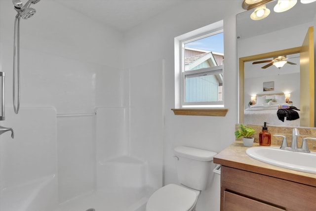 1002 N Oasis Ave, Deer Park, WA 99006 - ensuite bathroom featuring vanity, toilet, ceiling fan, and a shower