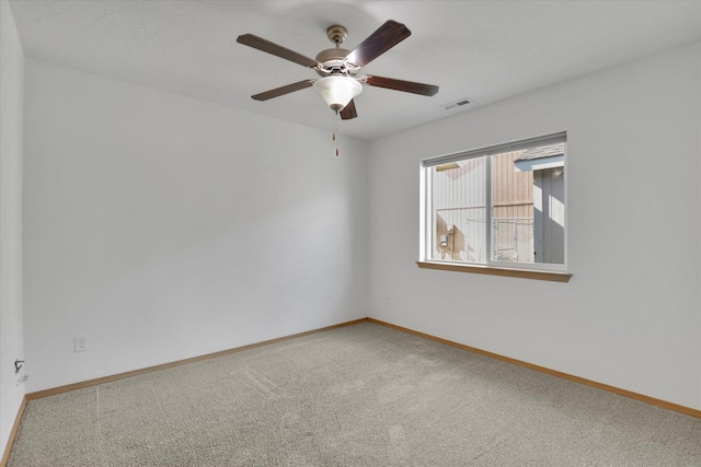 1002 N Oasis Ave, Deer Park, WA 99006 - empty room featuring carpet flooring, ceiling fan, and baseboards