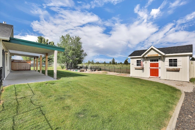 1002 N Oasis Ave, Deer Park, WA 99006 - view of yard featuring a patio and an outbuilding