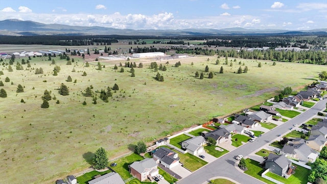 1002 N Oasis Ave, Deer Park, WA 99006 - aerial overview of property's location with a mountainous background