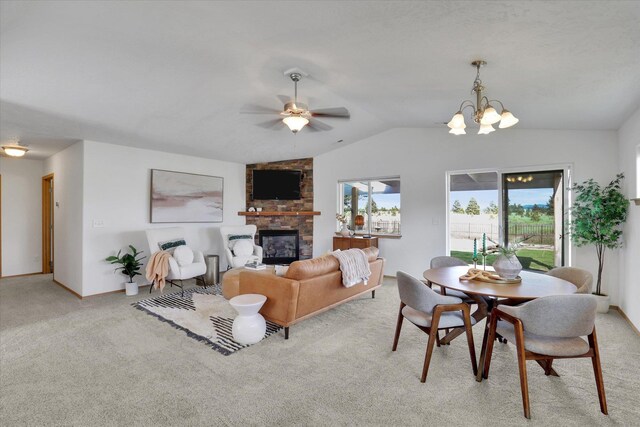 1002 N Oasis Ave, Deer Park, WA 99006 - carpeted living area featuring lofted ceiling, a fireplace, a ceiling fan, a chandelier, and baseboards
