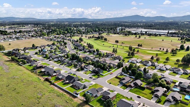 1002 N Oasis Ave, Deer Park, WA 99006 - aerial overview of property's location with a water and mountain view and a golf club