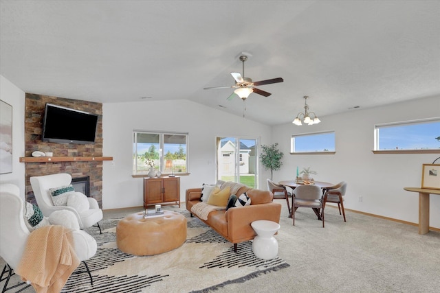 1002 N Oasis Ave, Deer Park, WA 99006 - living room featuring vaulted ceiling, a stone fireplace, ceiling fan, a chandelier, and baseboards