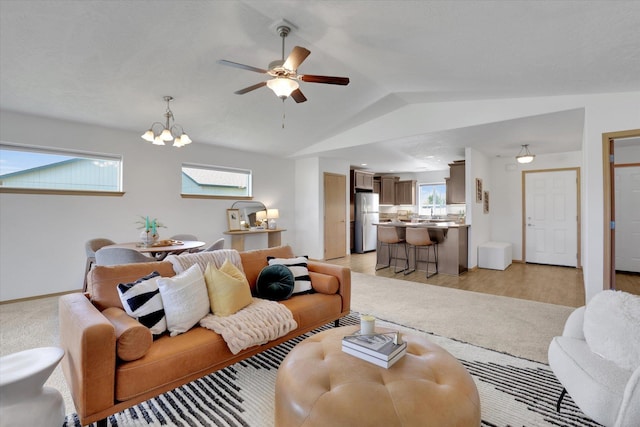 1002 N Oasis Ave, Deer Park, WA 99006 - living room featuring vaulted ceiling, a ceiling fan, baseboards, and a chandelier