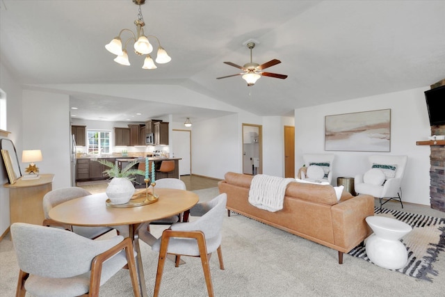 1002 N Oasis Ave, Deer Park, WA 99006 - dining space featuring vaulted ceiling, a ceiling fan, baseboards, light carpet, and a chandelier