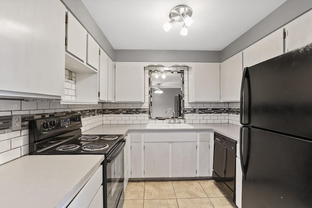 3424 E 32nd Ave, Spokane, WA 99223 - kitchen with black appliances, a sink, decorative backsplash, and light countertops