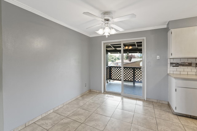 3424 E 32nd Ave, Spokane, WA 99223 - unfurnished dining area featuring ornamental molding, ceiling fan, baseboards, and light tile patterned flooring