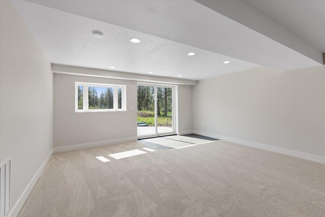 12510 N Craig Rd, Nine Mile Falls, WA 99026 - empty room with light colored carpet, baseboards, recessed lighting, and a textured ceiling