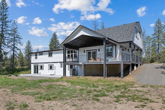 12510 N Craig Rd, Nine Mile Falls, WA 99026 - rear view of house featuring central AC, roof with shingles, a deck, and a patio
