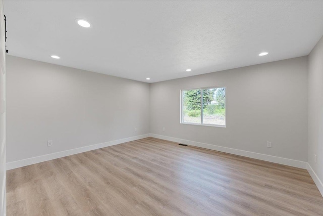 12510 N Craig Rd, Nine Mile Falls, WA 99026 - unfurnished room featuring recessed lighting, light wood finished floors, and baseboards