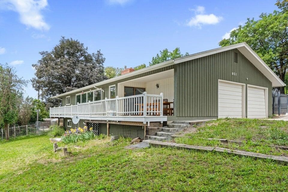 851 N Oak St, Colville, WA 99114 - rear view of property featuring a chimney, a deck, and a detached garage