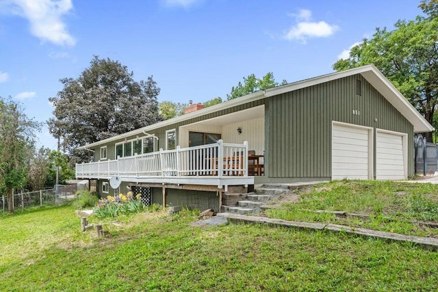 851 N Oak St, Colville, WA 99114 - rear view of property featuring a chimney, a deck, and a detached garage