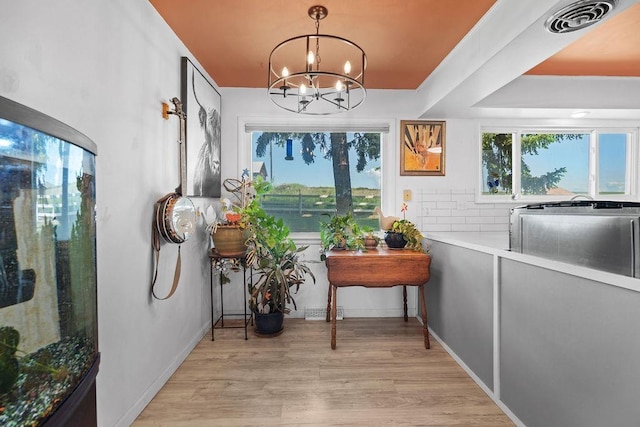 611 E Mill St, Latah, WA 99018 - sunroom featuring a chandelier and plenty of natural light