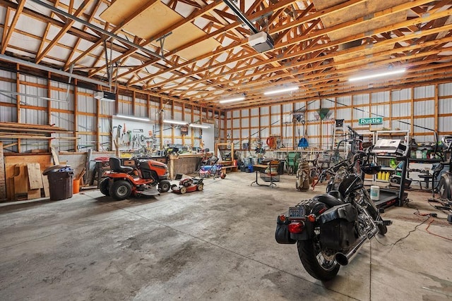 611 E Mill St, Latah, WA 99018 - garage with a workshop area and a garage door opener