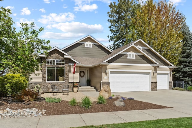 526 W Willapa Ct, Spokane, WA 99224 - craftsman house featuring stone siding, a garage, driveway, and a shingled roof