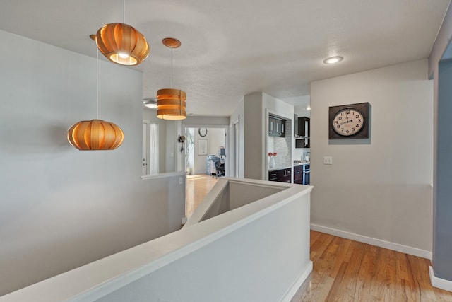 526 W Willapa Ct, Spokane, WA 99224 - corridor featuring light wood-type flooring and baseboards