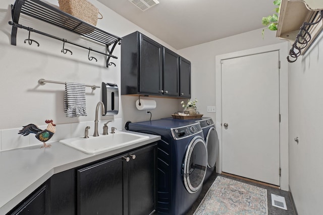526 W Willapa Ct, Spokane, WA 99224 - washroom with cabinet space and washing machine and clothes dryer