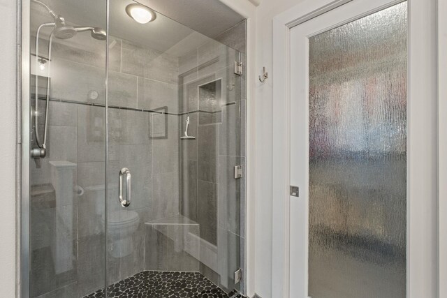 526 W Willapa Ct, Spokane, WA 99224 - bathroom featuring a shower stall and toilet