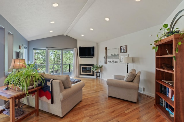 526 W Willapa Ct, Spokane, WA 99224 - living room with light wood-style floors, a glass covered fireplace, recessed lighting, and baseboards