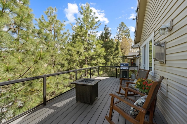 526 W Willapa Ct, Spokane, WA 99224 - wooden terrace with an outdoor fire pit and area for grilling