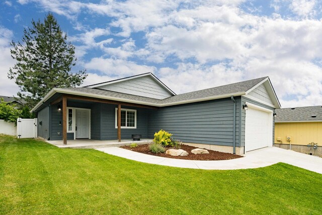 704 E Canterbury Ln, Colbert, WA 99005 - back of house featuring concrete driveway, a garage, and a shingled roof