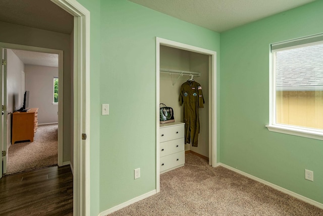 704 E Canterbury Ln, Colbert, WA 99005 - bedroom with baseboards, carpet flooring, and a closet