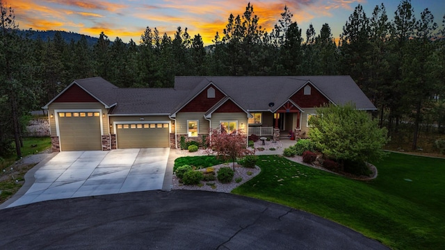 13906 E 39th Ln, Veradale, WA 99037 - craftsman-style house with a garage, driveway, a front yard, and covered porch