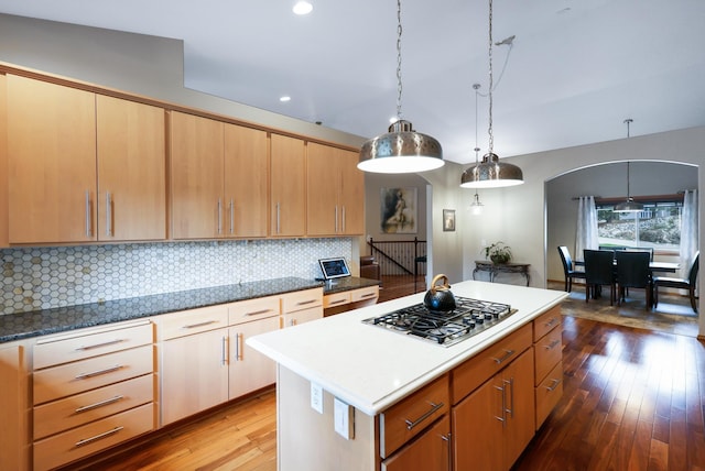 13906 E 39th Ln, Veradale, WA 99037 - kitchen with stainless steel gas stovetop, hardwood / wood-style floors, tasteful backsplash, a kitchen island, and hanging light fixtures
