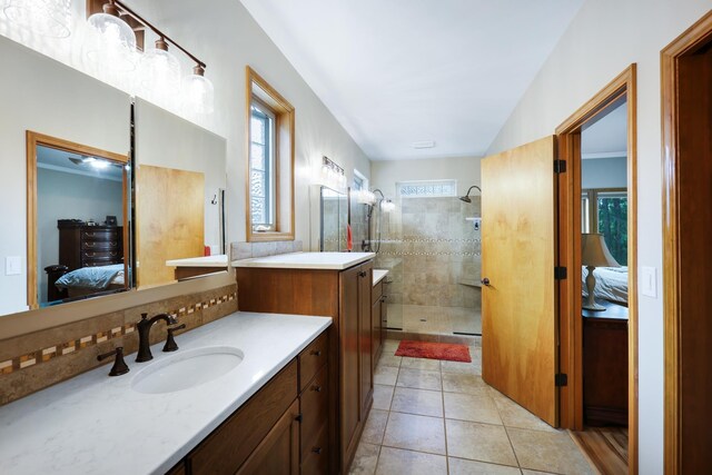 13906 E 39th Ln, Veradale, WA 99037 - ensuite bathroom with a tile shower, vanity, and tile patterned flooring