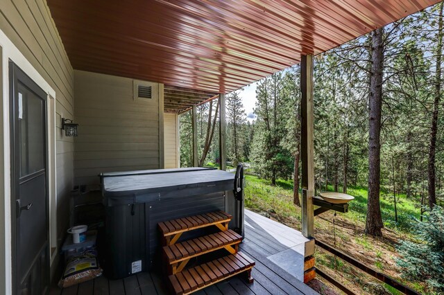 13906 E 39th Ln, Veradale, WA 99037 - deck featuring a hot tub and a forest view