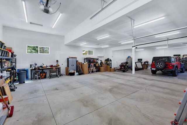 13906 E 39th Ln, Veradale, WA 99037 - garage featuring a garage door opener and a workshop area