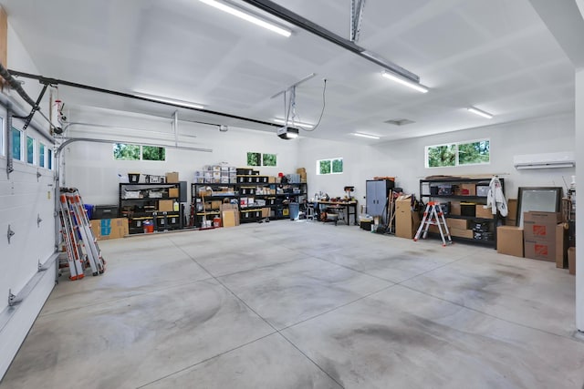 13906 E 39th Ln, Veradale, WA 99037 - garage featuring a wall mounted AC and a garage door opener