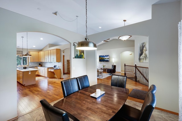 13906 E 39th Ln, Veradale, WA 99037 - dining area with arched walkways, vaulted ceiling, recessed lighting, and light wood-style flooring