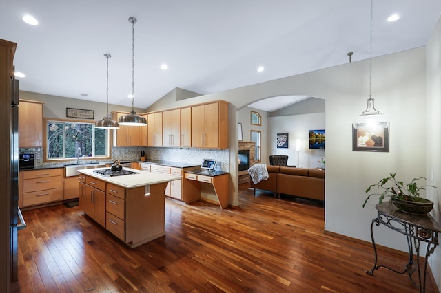13906 E 39th Ln, Veradale, WA 99037 - kitchen featuring lofted ceiling, decorative backsplash, a sink, dark wood-style flooring, and stainless steel gas stovetop
