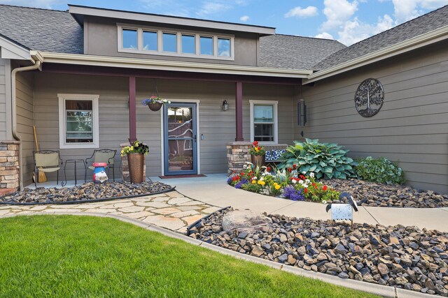 1002 N High Desert Dr, Deer Park, WA 99006 - view of exterior entry with covered porch and a shingled roof