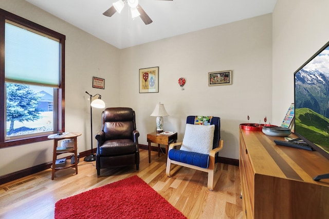 1002 N High Desert Dr, Deer Park, WA 99006 - sitting room with light wood-style flooring, a ceiling fan, and baseboards