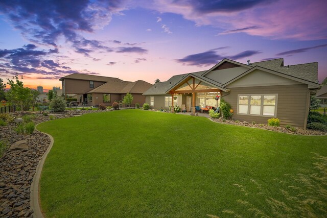 1002 N High Desert Dr, Deer Park, WA 99006 - view of front facade with a lawn, a patio area, and roof with shingles