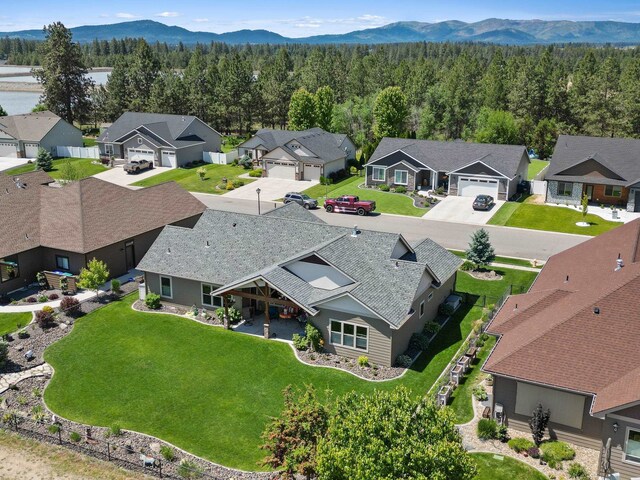 1002 N High Desert Dr, Deer Park, WA 99006 - aerial perspective of suburban area with a forest and mountains