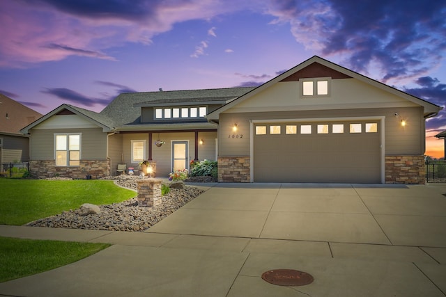 1002 N High Desert Dr, Deer Park, WA 99006 - view of front facade with stone siding, driveway, and a porch