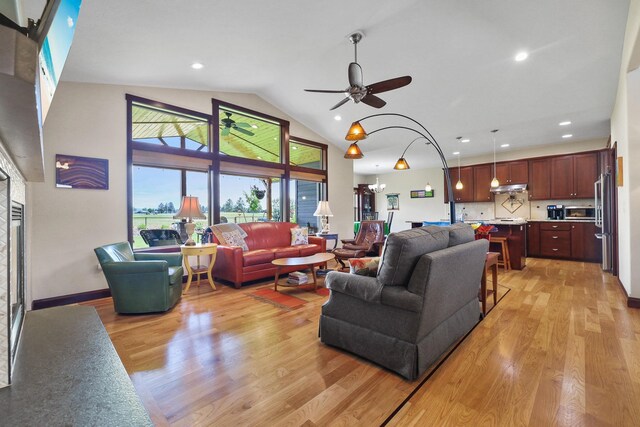 1002 N High Desert Dr, Deer Park, WA 99006 - living room featuring light wood-style flooring, a ceiling fan, high vaulted ceiling, and recessed lighting