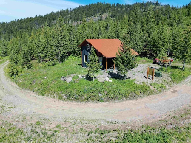 1261 Outback Ln, Usk, WA 99180 - view of subject property with a heavily wooded area
