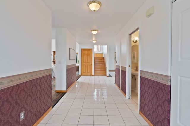 609 E Wild Rose Rd, Colbert, WA 99005 - hall with a wainscoted wall, light tile patterned flooring, stairs, and baseboards