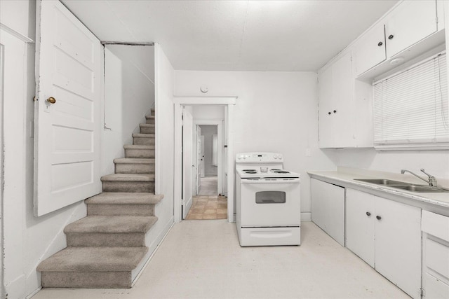 2304 E Dalke Ave, Spokane, WA 99207 - kitchen with electric stove, a sink, white cabinetry, and light countertops