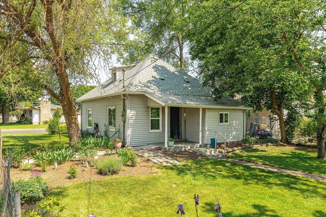 2304 E Dalke Ave, Spokane, WA 99207 - view of front of property featuring a shingled roof and a front yard